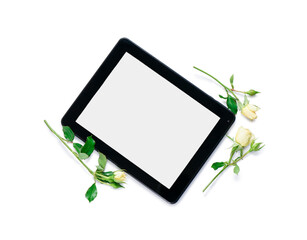 Tablet computer with roses on white background
