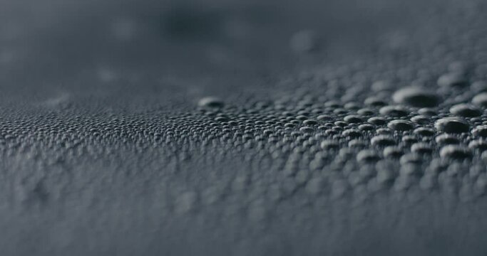 Boiling hot water bubbles on surface in macro close up