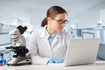 Female young Scientist Working in The Lab