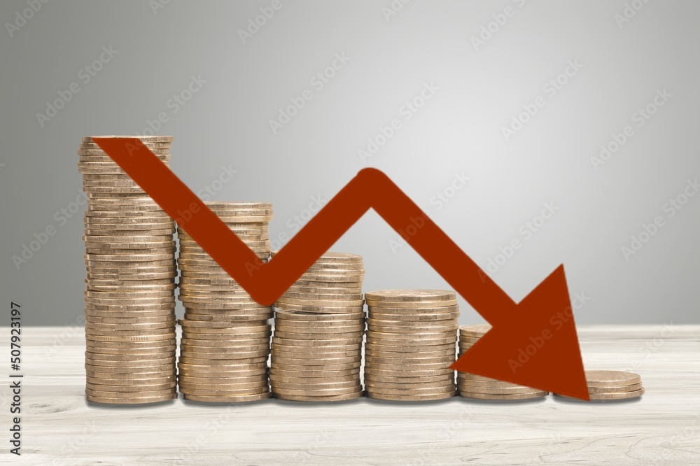 Canvas Prints Stack of coins bar chart and graph trending downwards. Economy recession crisis, inflation, stagflation, business and financial loss concept.