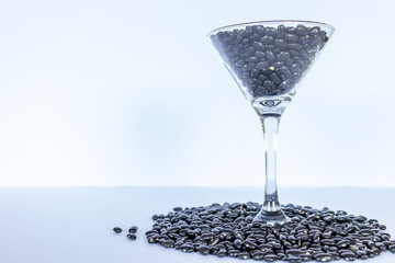 black beans grains inside a cocktail glass, Global food crisis concept