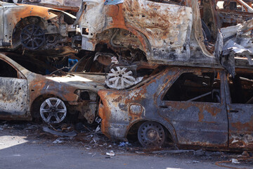 war in ukraine. Car graveyard. Shot cars of civilians. russia's war against Ukraine. Burnt and blown up car. Cars damaged after shelling. irpin bucha. war crimes