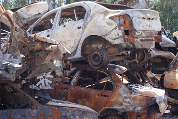 war in ukraine. Car graveyard. Shot cars of civilians. russia's war against Ukraine. Burnt and blown up car. Cars damaged after shelling. irpin bucha. war crimes