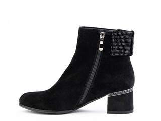 Women's autumn ankle black suede boots with black zip and average heels, isolated white background. left side view. Fashion shoes.