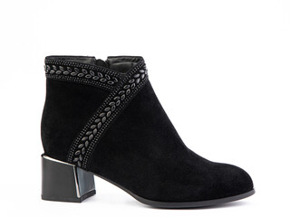 Women's autumn ankle black suede boots with black zip and average heels, isolated white background. Right side view. Fashion shoes.