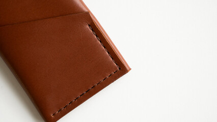 Empty men's business handmade leather card holder with isolated on white background. Selective focus, copy space, close up.