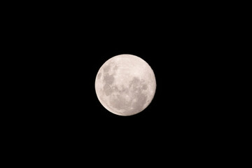 Full moon in the dark night sky.