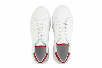 White leather sneakers. Casual women's style. White lacing and white rubber soles. Isolated close-up on white background. Top view. Fashion shoes