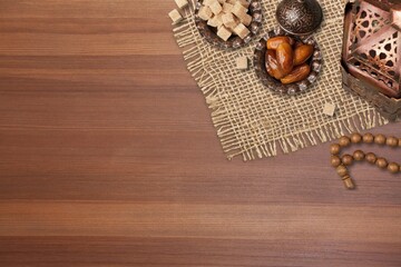 Bronze plate with dates on old wooden table.