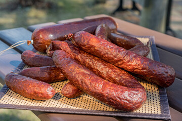 Diferent dried sausages on the table