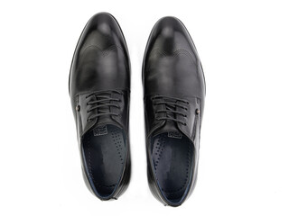 A pair of classic leather elegant men's shoes isolated white background. Groom's stylish black shoes. Isolated object close up on white background.