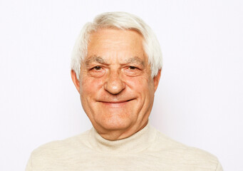 lifestyle, emotion and old people concept: Close up portrait of happy senior man over white background