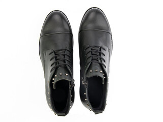 A pair of classic leather elegant men's shoes isolated white background. Groom's stylish black shoes. Isolated object close up on white background.