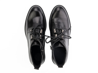 A pair of classic leather elegant men's shoes isolated white background. Groom's stylish black shoes. Isolated object close up on white background.