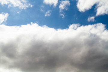 Cumulus clouds. White clouds on a blue background.