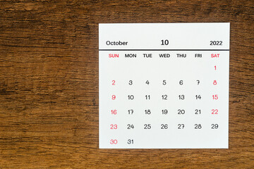 Top views Calendar desk October is the month for organizers to plan and remind on the wooden table...
