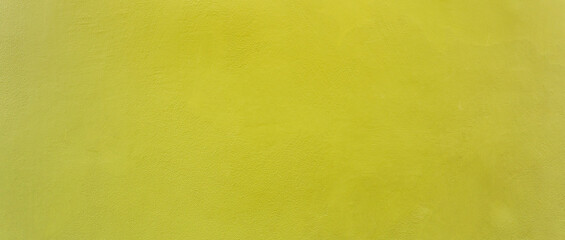 Yellow color old grunge wall concrete texture as background, Wide banner