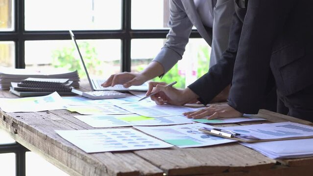 Sale tax loan broker advice brief and point hand to graph report talk to client at office desk show budget chart data or legal result on claim form. Trust will in work plan.