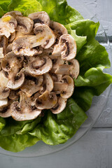 salad, mushroom, bed, lettuce, bibb, herbs, dressing, simple, sliced, mushrooms, glass plate, blue, wood, board, bright, sunny, lunch, light, healthy, olive oil, lemon, seasoned, seasoning
