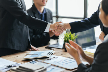 Business people agreement during board meeting in office, Teamwork Deal Cooperation Partnership business people shaking hands. - obrazy, fototapety, plakaty