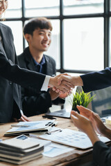 Business people agreement during board meeting in office, Teamwork Deal Cooperation Partnership business people shaking hands.