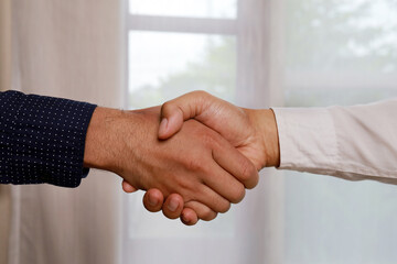Partner Business  signing contractpaper  for partnership and law, Business owners shake hands to agree to work.Partners hold hands to accept work.Businessman feedback document concept