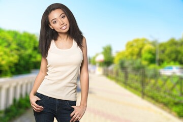 Fototapeta premium Beautiful relaxed happy woman on a outdoor background