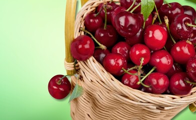 Fresh ripe cherries on a wooden table on natural background
