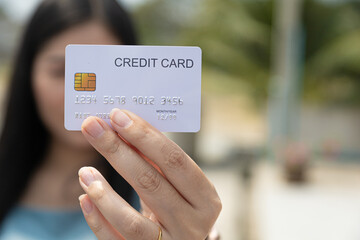 Closeup hand takes of credit card for financial transactions