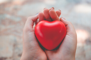 Woman hold red heart