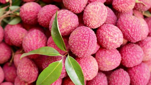 Pile Lychee Rotating Background. Slow Motion 4K.