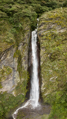 Aerial view of a waterfall in the Peruvian Andes. Fresh water source from high mountain.