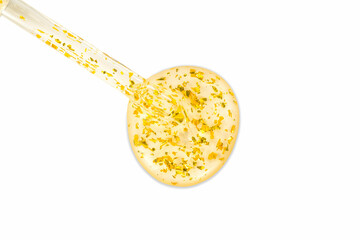 Dropping serum gold collagen moisturizer of face soft light background. Protector skin Treatment facial essence oil, Vitamin C. Beauty and spa Concept