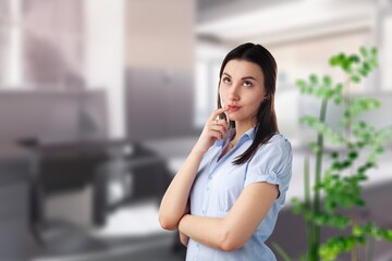Fototapeta premium Peaceful thoughtful young woman in casual looking at window away