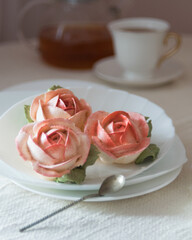 Homemade marshmallows in shape of rose flowers. Zephyr flowers.