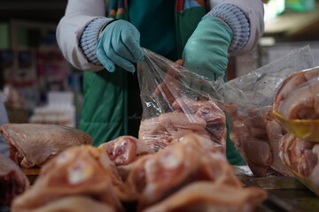 Almaty, Kazakhstan - 03.25.2022 : Sale of chicken meat on the open market