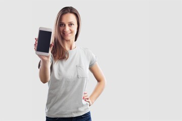 Fototapeta premium Happy woman showing mobile phone