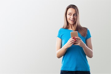 Happy woman showing mobile phone
