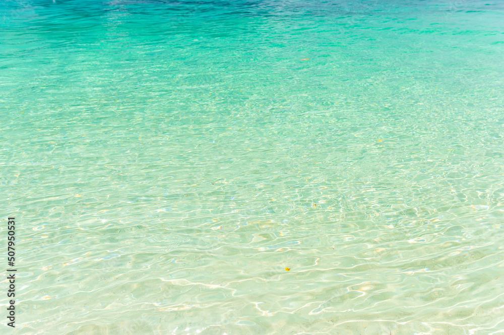 Wall mural Beach and sea view on Lipe island, Satun Province, Thailand, andaman sea where you can watch the sunrise and sunset on the same beach.