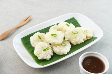 Cireng, a savory snack from West Java, Indonesia, made from tapioca flour and deep-fried, served with a spicy sauce.
