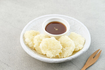 Cireng, a savory snack from West Java, Indonesia, made from tapioca flour and deep-fried, served with a spicy sauce.
