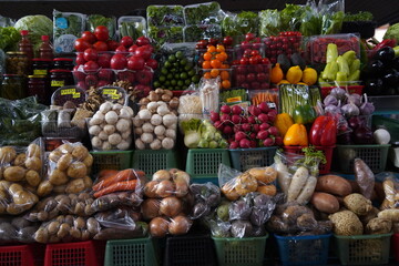 Almaty, Kazakhstan - 03.25.2022 : Sale of various vegetables and fruits at the market stalls.