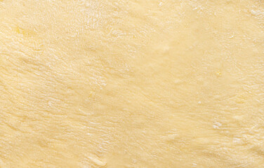 Texture of evenly rolled dough.Background of the dough for baking.
