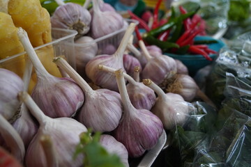 Almaty, Kazakhstan - 03.25.2022 : Sale of fresh garlic on the counter at the market.