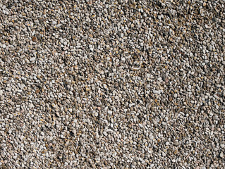 Small pebbles of crushed stone as an abstract background.