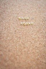 Good mood text on cork background. Mood board background. Positive phrase. Letters on cork wallpaper. Positive slogan. Creative message. Lifestyle concept. Letters on board with copy space.