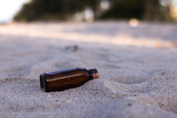 Beach pollution. Plastic bottles and other trash on sea beach. Ecological concept. earth day...