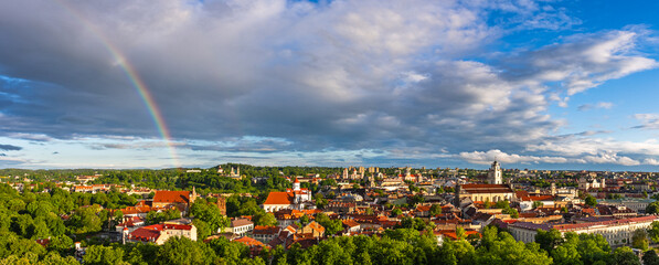 Rainbow over Vilnius old town, colorful evening view of Vilnius, capital of Lithuania