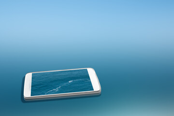 Mobile phone screen with blue ocean water