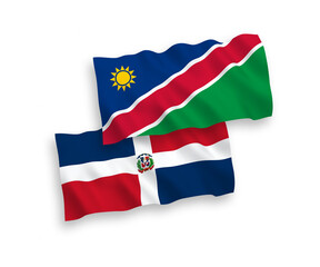 National vector fabric wave flags of Dominican Republic and Republic of Namibia isolated on white background. 1 to 2 proportion.